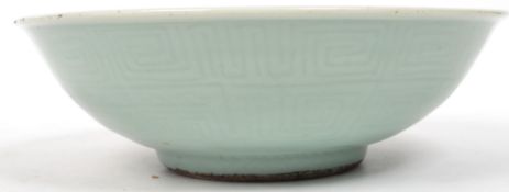 An early 19th century Chinese Celadon bowl having a Greek key pattern under the glaze. Measures