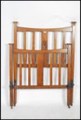 An Arts & Crafts oak head and footboard for a sing