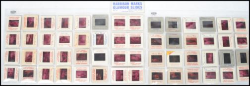 A collection of vintage 20th century Harrison Marks nude erotic glamour 35mm slides all with names