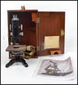 A vintage mid 20th century microscope by Watson & Sons, 313 High Holborn, London, with three