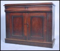 A Victorian mahogany chiffonier / dresser base being raised on a plinth base having double door