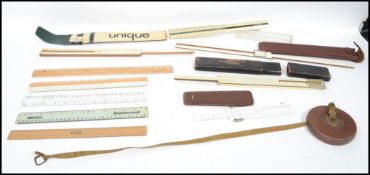 A collection of vintage measures and rules to include cased examples. Faber Castell, Norit,