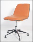 A retro 20th century swivel office / board chair in the manner of Herman Miller, having an orange