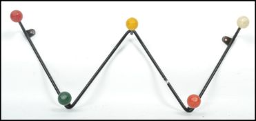 A vintage retro 20th century  sputnik atomic set of coat hooks in a painted black finish with