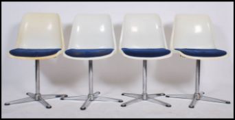 A set of four Swivel chairs / dining chairs marked for Centa designed by Oskar Winkler , the