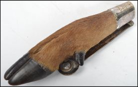 A vintage 20th century taxidermy example of a deer foot modelled as a door knocker. The top having