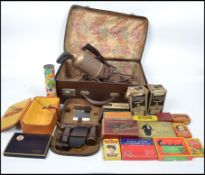 A good collection of vintage 20th century items to include various advertising tins, Osram bulbs