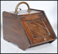 A Victorian oak coal scuttle - purdonium having chevron hinged top with lined interior complete with