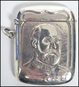 A 20th century silver vesta case with embossed image of King George V. Total weight 28.8g.