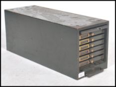 A vintage mid 20th century industrial desk top index filing cabinet / chest having five slim drawers
