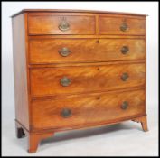 A 19th century mahogany and crossbanded bow front chest, containing two short over three long