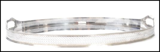 A stunning large silver plated gallery tray, sweeping handles to the sides with  fret pierced