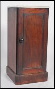 A Victorian marble topped mahogany pot / storage cupboard with hinged door and knob handle, the