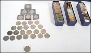 A collection of pre decimal coins contained within pouches dating from the early 20th century.