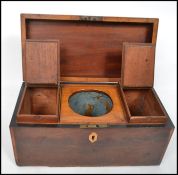 A 19th century flame mahogany and rose wood cross banded tea caddy having a hinged lid opening to