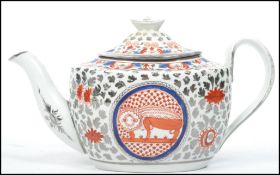 An early 19th century English ceramic teapot decorated in an Oriental Chinese pattern with leaves