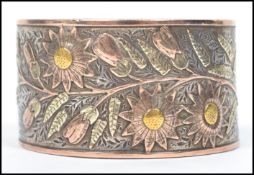 A 19th century believed Russian silver and gilt decorated napkin ring of half moon shape adorned