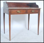 A good Edwardian mahogany and rouge marble writing table desk being raised on squared legs with twin
