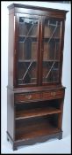 A 20th century mahogany Regency revival library bookcase cabinet. The base with drawers and