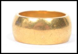 A hallmarked 22ct gold heavy wedding band ring of plain form, weighs 14.7 grams size J.