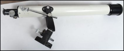 A vintage 20th century cased telescope. Made in Japan, the white telescope complete with the