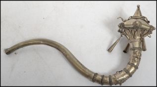 A silver white metal 20th century Chinese opium pipe decorated with rope work, flowers and bead