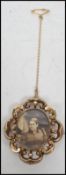 A 19th century 9ct gold mourning brooch having a chased scrolled and beaded border with central