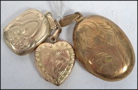A group of jewellery locket pendants to include a 9ct front and back example and two other yellow