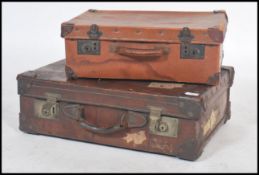 A vintage 20th century full grain leather suitcase with dual brass lock with notation for