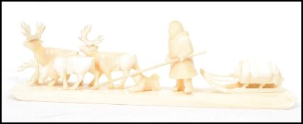 WITHDRAW  An early 20th century North American bone carving of an Inuit scene depicting elk