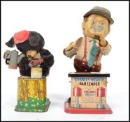 Two battery operated figures, Charley Weaver Bartender and another in the form of a bear tending