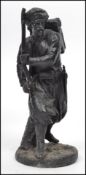 A 19th century cast spelter figurine of an anglo-colonial British soldier with backpack and musket