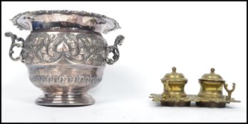 A 19th century silver plated EPBM rococo urn - wine cooler having decorative cast design in relief