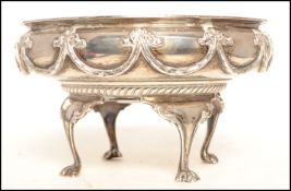 An early 20th century Edwardian silver hallmarked table centerpiece bowl / bon bon dish raised on