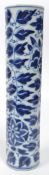 An early 20th century Chinese blue and white sleeve vase of slender form having four blue