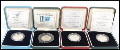 A group of Royal Mint silver proof coins to include United Kingdoms 150 years of public libraries