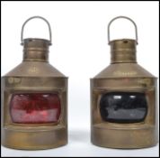A pair of vintage 20th century copper ships lanterns with red and blue glass fronts , loop handles
