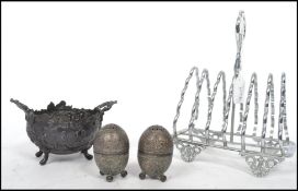 A 19th century pewter rococo cauldron table salt bowl with twin handles together with a pair of 19th