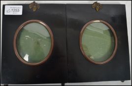 A pair of 19th century ebonised and convex glass picture frames of square form likely silhouette