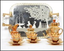 A vintage retro 20th century Murano studio art glass tea service having cups, saucers, sugar bowl,