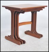 A retro 20th century nest of three E Gomme for G-Plan teak tables, the rectangular tops on