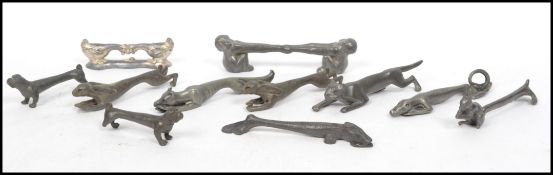 A good group of 19th century French novelty knife rests to include dogs, hares, monkeys etc,