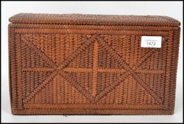 An early 20th century folk tramp prison art work box having typical carved zig zag panels and carved