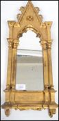 A 19th century gilt framed Florentine mirror of architectural form having ornate scrolls and