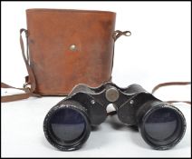 A pair of vintage 20th century leather cased binoculars by Karl Kainz stamped to the binoculars.