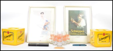 A collection of mid century advertising point of sale items all pertaining to Schweepes to include