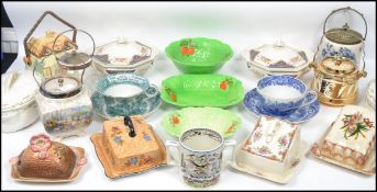 A collection of vintage 20th century cheese dishes and biscuit barrels to include examples by