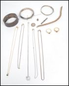 A group of sterling silver and yellow metal jewellery to include three silver hallmarked bangles,