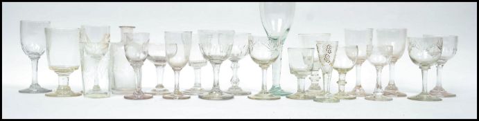A good collection of 18th and 19th century drinking glasses to include sherry glasses, port, wine
