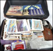 Suitcase with quantity of various collectable items:postcards,photos,stamps,ephemera,medallion